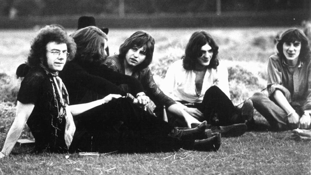 King Crimson sitting on an area of grass, 1969